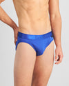 Model wears Bamboo Mens Brief in Surf The Web. On body side view
