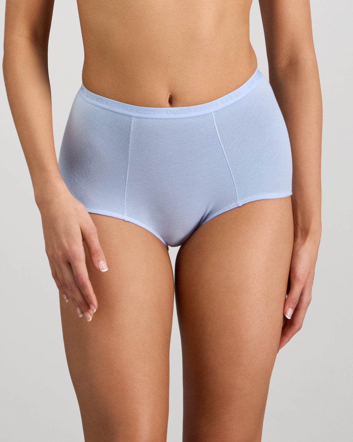 Model wears Body Cotton Full Brief in SKYWAY. On body front view