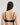 Model wears Sheer Essence Underwire Bra in BLACK. On body back view