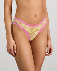 Model wears Leo Bikini in LEMON/FUCHSIA PINK. On body side view