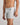 Model wears Bamboo Mens Trunk in GREY MARLE. On body side view