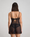 Model wears Ava Rose Babydoll in BLACK. On body back view