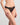Model wears Grand Finale Thong in BLACK. On body side view