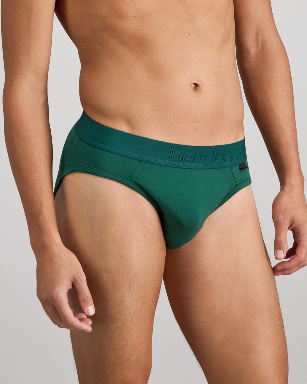Model wears Bamboo Mens Brief in RAIN FOREST. On body side view