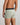 Model wears Everyday Essential Mens Trunk in ICEBERG GREEN. On body back view