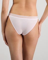 Model wears Stripe Elastic & Papertouch Tanga in FESTIVAL BLOOM. On body back view