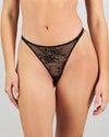 Model wears Scarlet Lover Thong in BLACK. On body front view