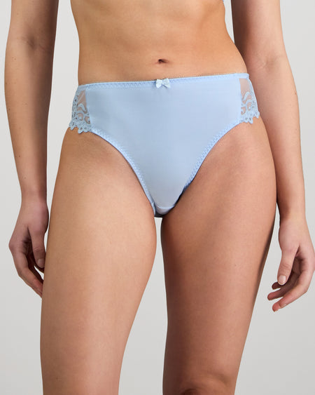 Model wears Coral High Cut Brief in SKYWAY. On body front view