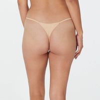 Model wears Clemence Thong in AMERICAN NUDE. On body back view