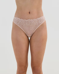 Model wears All Lacey Thong in LATTE. On body front view