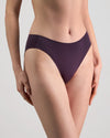 Model wears Au Naturel High Cut Brief in PLUM PERFECT. On body side view