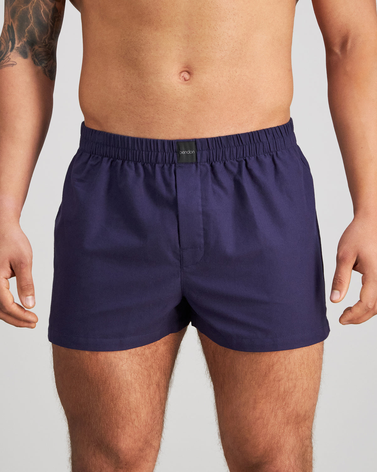 Model wears Classic Woven Boxer in PEACOAT. On body front view