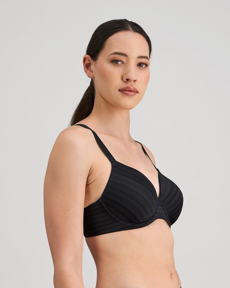 Model wears Rita Contour Bra in BLACK. On body side view