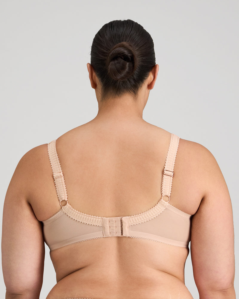 Model wears Faithful Underwire Bra in LATTE. On body back view