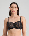 Model wears Aria Underwire Bra in BLACK. On body front view