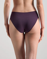 Model wears Au Naturel High Cut Brief in PLUM PERFECT. On body back view