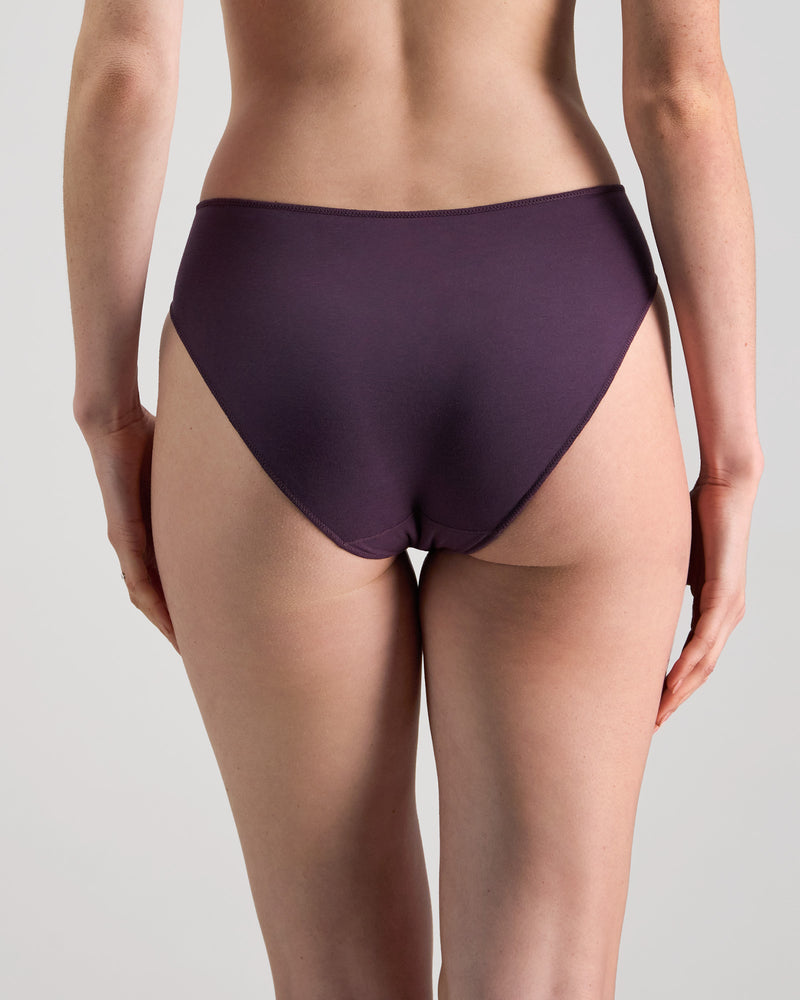 Model wears Au Naturel High Cut Brief in PLUM PERFECT. On body back view