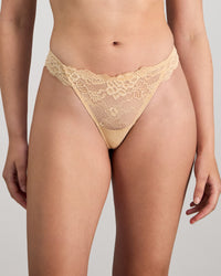 Model wears My Fit Lace Thong in FRAPPE. On body front view