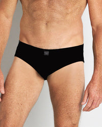 Model wears High Tech Cotton Mens Brief in BLACK. On body front view
