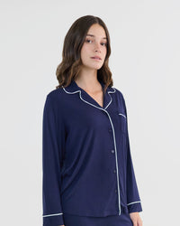 Model wears Bamboo Bliss Long Sleeve PJ Top in NAVY BLAZER. On body side view