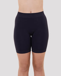 Model wears Smoothing Bodywear Chafer Short in BLACK. On body front view