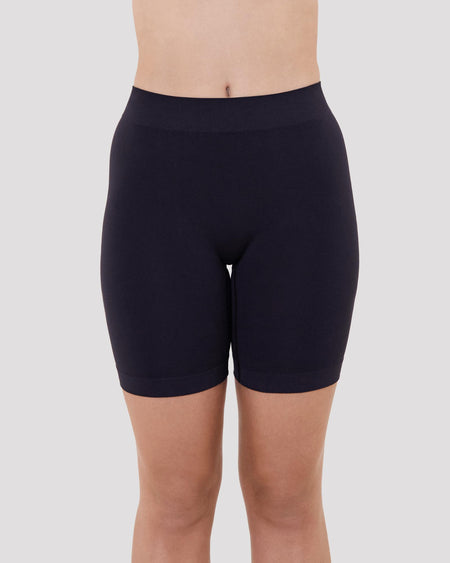 Model wears Smoothing Bodywear Chafer Short in BLACK. On body front view