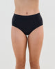 Model wears Seamless Soft Full Brief in BLACK. On body front view