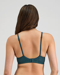 Model wears Yvette Underwire Bra in MEDITERRANEA. On body back view