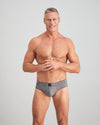 Model wears High Tech Cotton Mens Brief in GREY MARL. On body front view