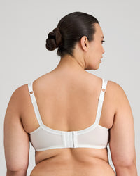 Model wears Charlotte Underwire Bra in WHITE. On body back view