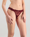 Model wears My Fit Lace Thong in WINDSOR WINE. On body side view