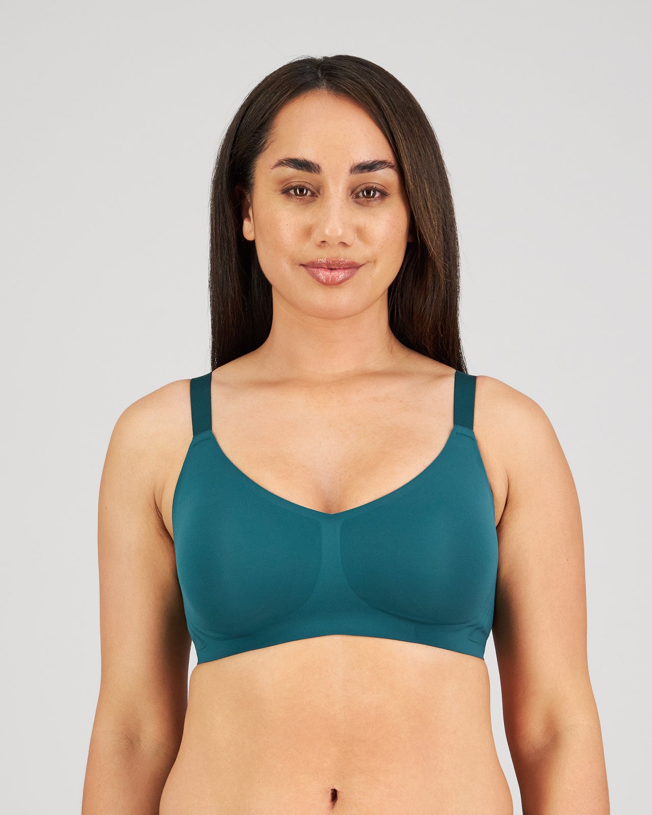 Model wears Comfit Collection Wire Free Bra in RAIN FOREST. On body front view
