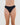 Model wears Seamless Soft Thong in BLACK. On body front view