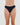 Model wears Seamless Soft Thong in BLACK. On body front view