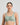 Model wears Power Underwire Bra in ICEBERG GREEN. On body front view