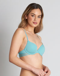 Model wears Stripe Elastic & Papertouch Push Up Bra in PORCELAIN. On body side view