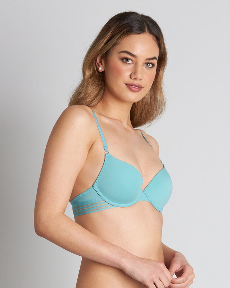 Model wears Stripe Elastic & Papertouch Push Up Bra in PORCELAIN. On body side view