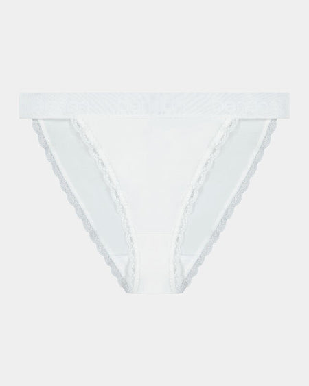 Model wears Cotton Logo Tanga in WHITE. On body front view