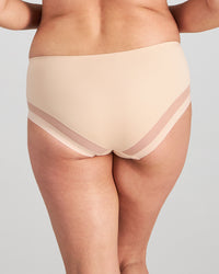 Model wears Comfit Collection Midi in LATTE. On body back view