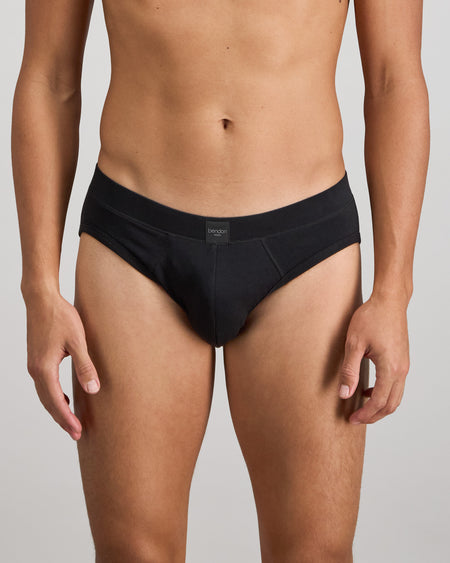 Model wears High Tech Cotton Mens Brief in BLACK. On body front view
