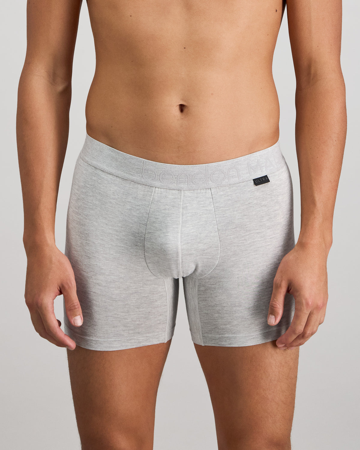 Model wears Bamboo Mens Trunk in GREY MARLE. On body front view