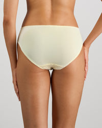 Model wears Lacey Bikini in TRANSPARENT YELLOW. On body back view