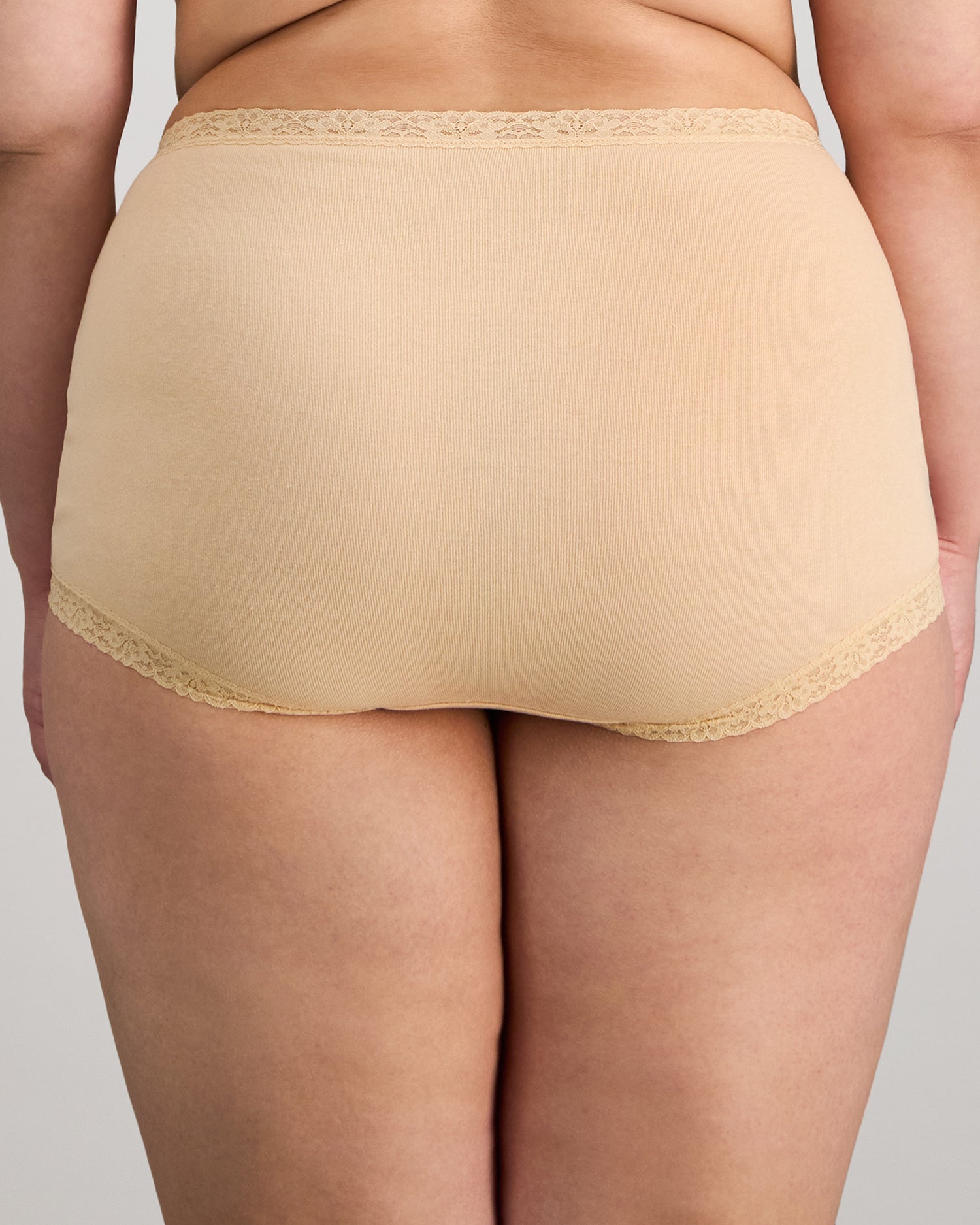 Model wears Bendon Cotton Full Brief in NATURELLE. On body back view