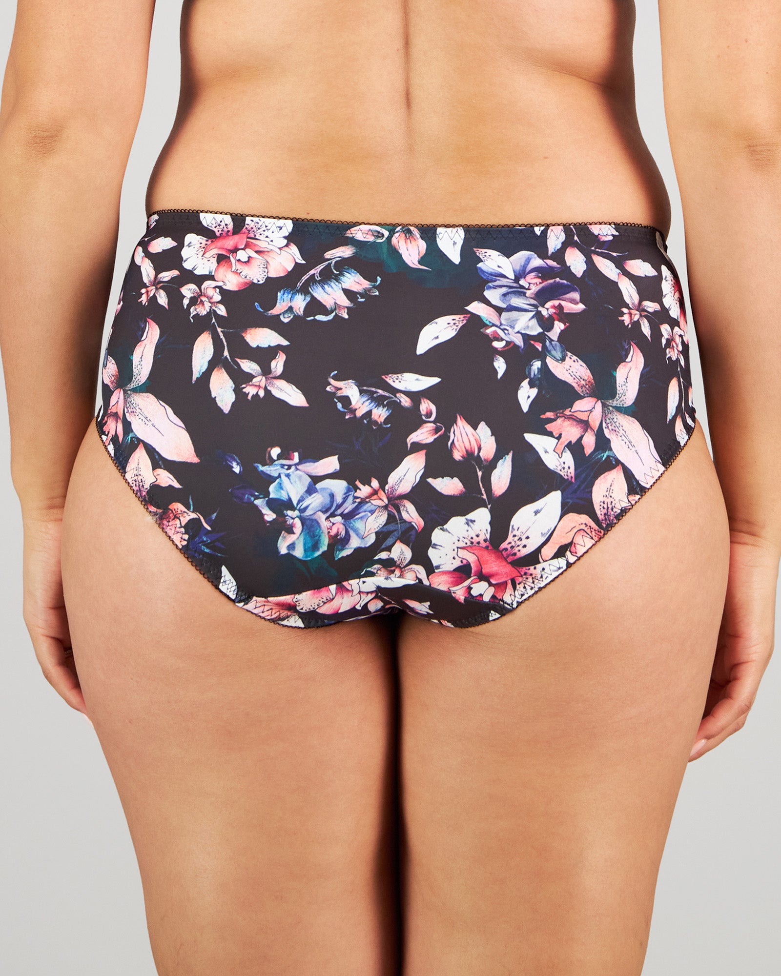 Model wears Wild Violet Full Brief in DARK FOLKLORE PRINT. On body back view