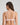 Model wears Simply Seamless Wire Free Bra in ICY PINK/WHITE STRIPE. On body back view