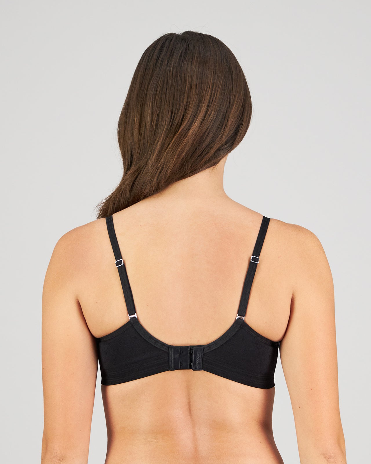 Model wears Bendon Body Lace Wire Free Bra in BLACK. On body back view