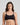 Model wears Extra-Ordinary Crop Top in BLACK. On body front view