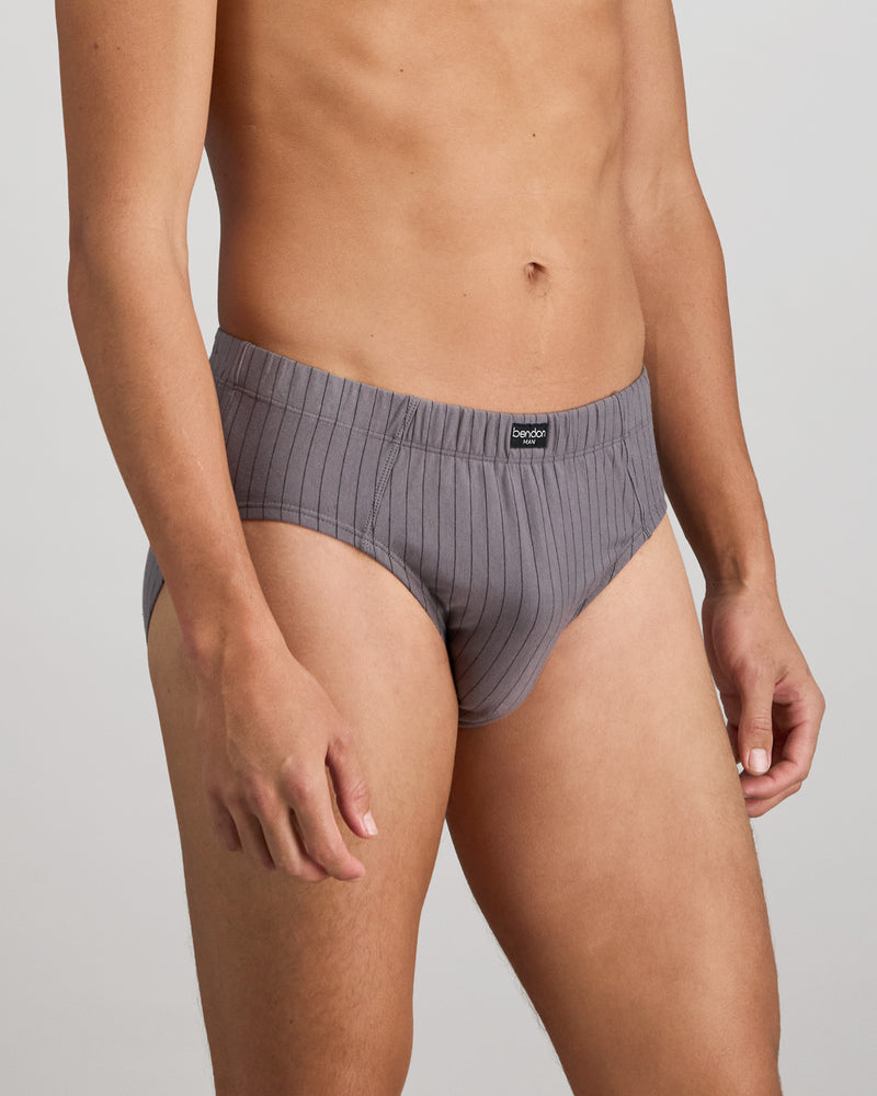 Model wears Cotton Stretch Mens Brief in ASH PINSTRIPE. On body side view