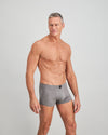 Model wears High Tech Cotton Mens Trunk in GREY MARL. On body side view