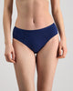 Model wears Body Cotton Bikini in Medieval Blue. On body front view